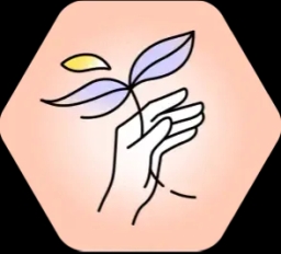 a hand holding a plant